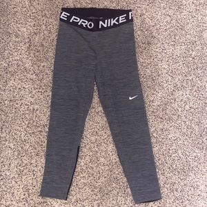 These are grey nike pro pants that are women’s small